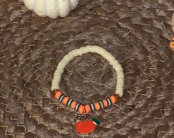 Clay bead bracelet with pumpkin charm