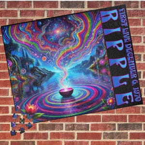 May include: A psychedelic jigsaw puzzle featuring a colorful, swirling design with a bowl floating on a lake. The puzzle is titled "RIPPLE" with the text "FIRST LIVE DECEMBER 6, 1970" on the right side.