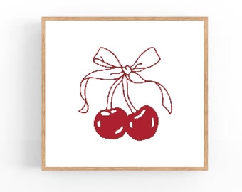 May include: A pair of red cherries tied together with a white ribbon bow.