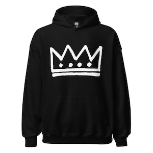 May include: Black hooded sweatshirt with a white crown graphic on the front. The crown design features a series of peaks and dots. The sweatshirt has a drawstring hood and a front pocket.
