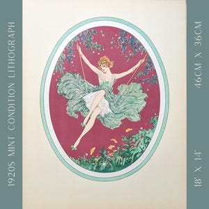 May include: A vintage lithograph print from the 1920s, featuring a woman on a swing within an oval frame. The artwork showcases a woman in a flowing green dress, with dimensions of 18 inches by 14 inches.