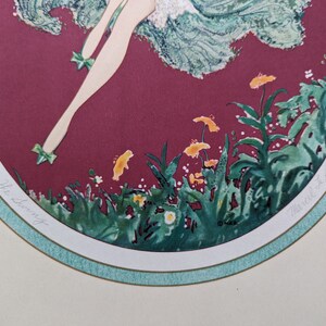May include: An art print titled "The Swing" featuring a stylized illustration of a figure in a flowing dress. The artwork has a burgundy background with green and yellow floral accents and a light green border.