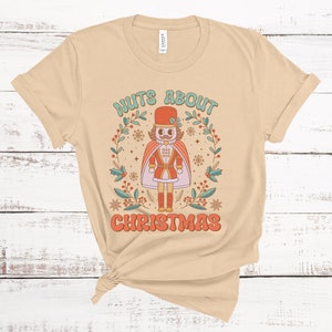 ナッツ・アバウト・クリスマス くるみ割り人形 ユニセックス Tシャツ