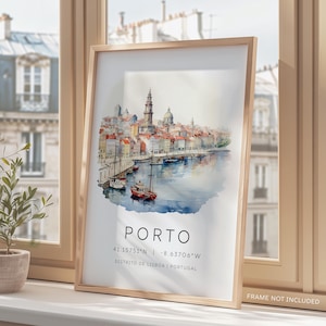 May include: A watercolor painting of the city of Porto, Portugal. The painting depicts a cityscape with buildings, a river, and boats. The text "PORTO" is written in white letters on a blue background. The coordinates "41.15751&deg;N - 8.63706&deg;W" and the text "DISTRITO DE LISBOA | PORTUGAL" are written in black letters on a white background.