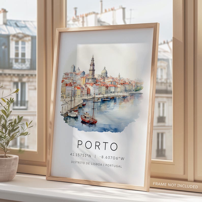 May include: A watercolor painting of the city of Porto, Portugal. The painting depicts a cityscape with buildings, a river, and boats. The text "PORTO" is written in white letters on a blue background. The coordinates "41.15751&deg;N - 8.63706&deg;W" and the text "DISTRITO DE LISBOA | PORTUGAL" are written in black letters on a white background.