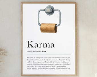 May include: Framed print with the word "Karma" and a definition. The image features a toilet paper roll holder with an empty cardboard tube. The text below describes the concept of karma in a humorous way.