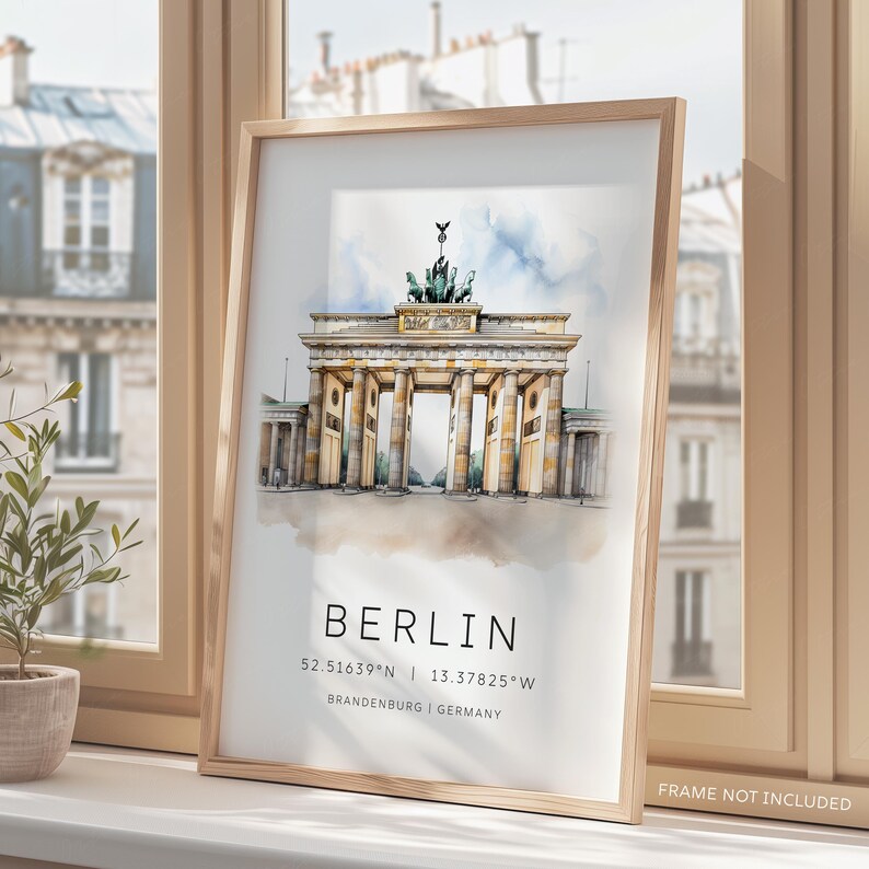 May include: A watercolor illustration of the Brandenburg Gate in Berlin, Germany. The gate is a famous landmark and is depicted in a light yellow color with a blue sky and white clouds in the background. The text "BERLIN" is printed below the gate, along with the coordinates "52.51639&deg;N | 13.37825&deg;W" and the words "BRANDENBURG | GERMANY".