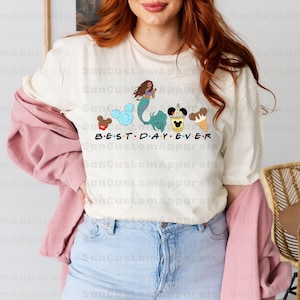 a woman with red hair wearing a mickey mouse shirt