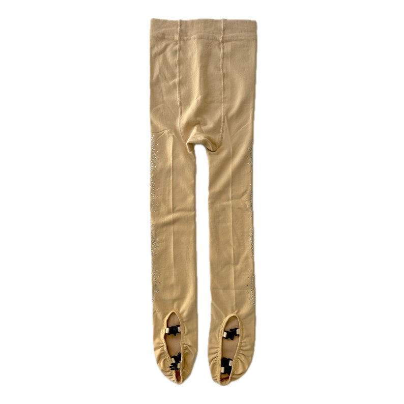 May include: Beige tights with a subtle sparkle and black straps at the toes.