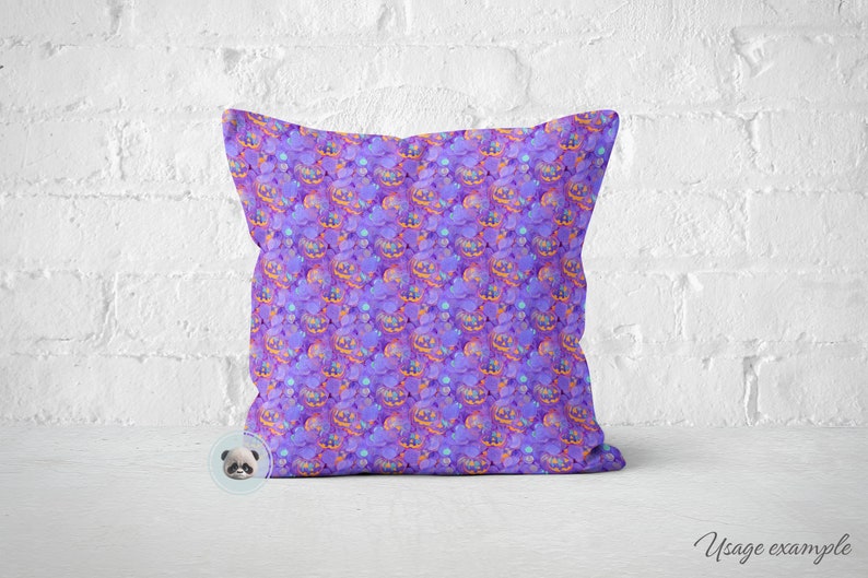 May include: Purple pillow with a repeating pattern of orange and purple jack-o'-lantern faces.