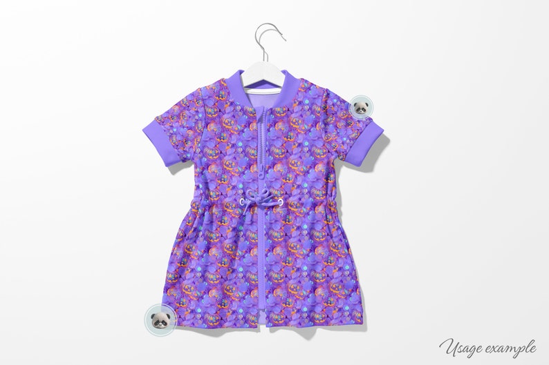 May include: A purple short-sleeved dress with a zipper closure and a drawstring waist. The dress has a colorful print of various objects, including a castle, a crown, and a heart.