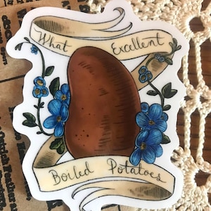 May include: A sticker featuring a brown potato with the text "What Excellent Boiled Potatoes" on a banner. The design includes blue flowers and green leaves, with a cream-colored background.
