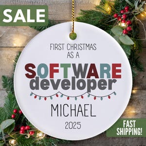 The image is a Christmas ornament with the text "SALE FIRST CHRISTMAS AS A SOFTWARE DEVELOPER MICHAEL 2025 FAST SHIPPING!" displayed prominently.