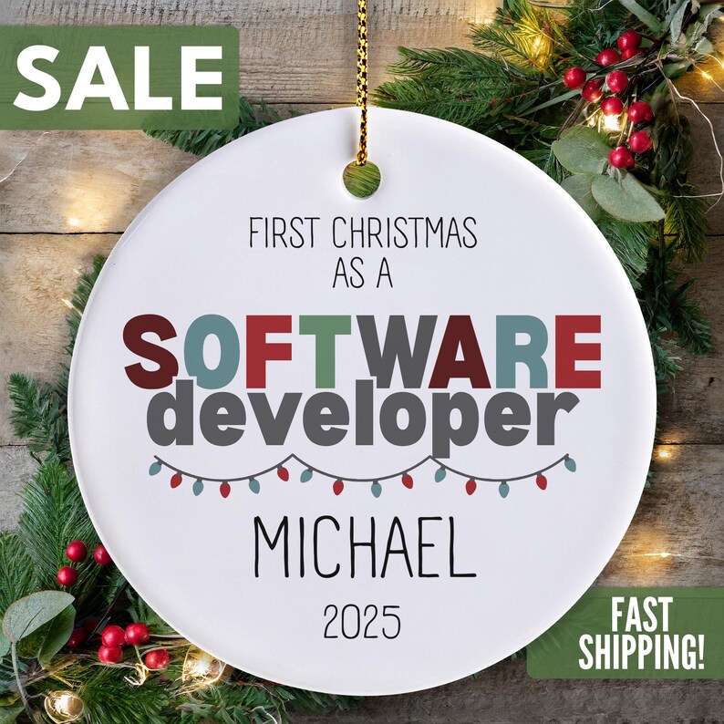 The image is a Christmas ornament with the text "SALE FIRST CHRISTMAS AS A SOFTWARE DEVELOPER MICHAEL 2025 FAST SHIPPING!" displayed prominently.
