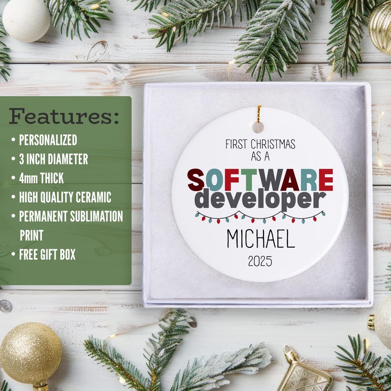 a white ornament box with a personalized ornament inside, along with a list of features for the ornament. The ornament is placed on a wooden surface, surrounded by Christmas decorations and ornaments.