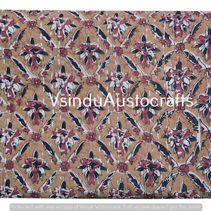 May include: A tan and red floral patterned quilt with a repeating design. The quilt features a diamond pattern with floral and leaf motifs in red, black, and white. The text "VsinduAustocrafts" is visible.