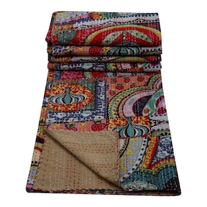 May include: A colorful kantha quilt with a patchwork design featuring various patterns, including paisley, floral, and geometric motifs. The quilt is made of cotton and has a light brown backing.
