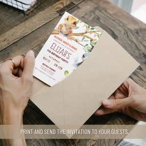 May include: A brown envelope with a folded invitation card inside. The invitation card is for Elijah's 7th birthday party. The card features a watercolor illustration of a lizard and other reptiles. The text on the card reads "Slither, Creep & Crawl Come and join us celebrate Elijah's 7th Birthday Party! Saturday May 25 1PM-5PM Reptile Exhibit 1234 Turtle Creek Rd, Concord, CA 12345 RSVP to Monica at 123.456.7890"