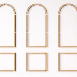 pre cut MDF wall molding pieces arranged on wall to show installation layout and arch panel design