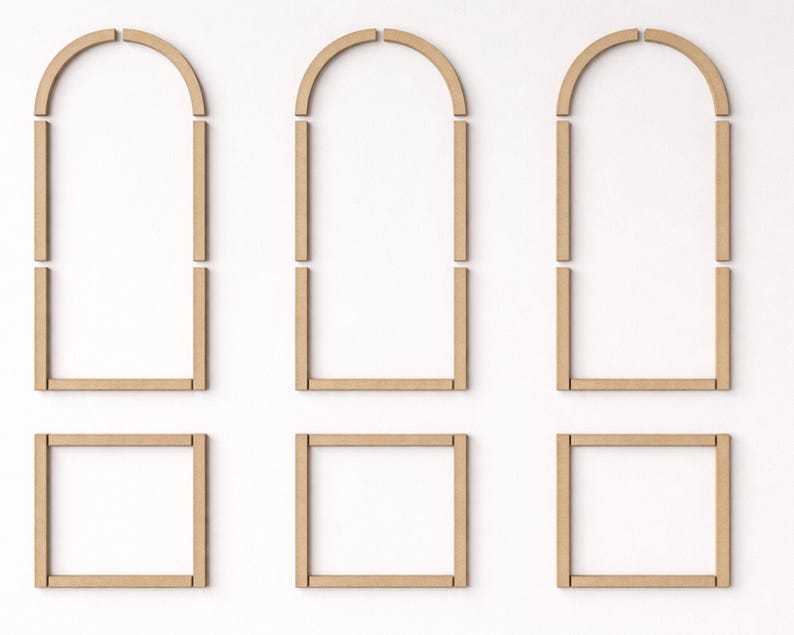 pre cut MDF wall molding pieces arranged on wall to show installation layout and arch panel design