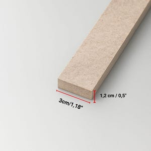 A rectangular piece of light brown wood, 1.18 inches wide, is shown against a white background. The wood has a rough, textured surface and appears to be a building material or craft supply.