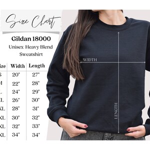 May include: Size chart for a Gildan 18000 unisex heavy blend sweatshirt. The chart shows the width and length measurements in inches for sizes S through 5XL.