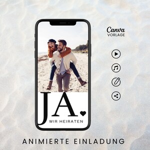 May include: A mobile phone screen displaying a wedding invitation with a photo of a couple on a beach. The text on the screen reads "JA. WIR HEIRATEN" which translates to "YES. WE ARE GETTING MARRIED". The phone screen also has icons for play, music, edit, and share.