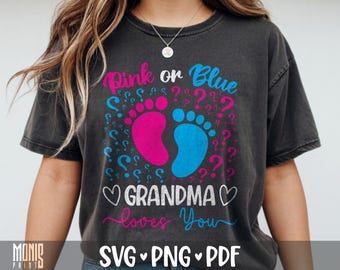 May include: A charcoal grey t-shirt featuring a graphic with the text Pink or Blue and Grandma loves You. The design includes a pink baby footprint, a blue baby footprint, and scattered pink and blue question marks with two white hearts.