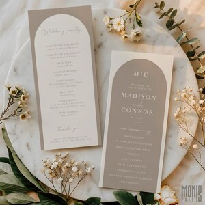 May include: Two wedding ceremony programs with a taupe arch design. The left program lists the wedding party, while the right program welcomes guests to Madison and Connor's wedding. Both programs feature elegant, minimalist typography.