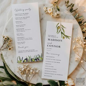May include: Two white wedding programs with olive branch illustrations. One program lists the wedding party, including the officiant, bridesmaids, and groomsmen. The other program welcomes guests to the wedding of Madison and Connor on 22.3.2027, with the ceremony details.
