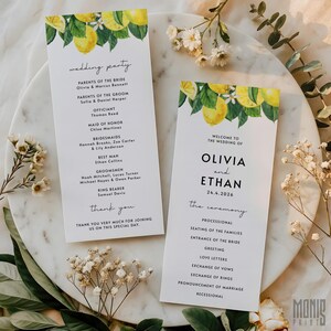 May include: Wedding ceremony program cards with a lemon and foliage design. The cards display the names of the wedding party, ceremony details, and the order of events. The text includes "Olivia and Ethan" and the date "24.4.2026".