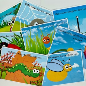 以下が含まれることがあります： クラフト活動の指示が書かれたカラフルなカードのセット。各カードには、カタツムリ、テントウムシ、イモムシ、ムカデ、ミツバチ、チョウなど、さまざまな昆虫や動物が描かれています。カードには、「この幸せなカタツムリのために貝殻を作りましょう」や「このムカデにたくさんの足をつけてください」などのテキストが含まれています。
