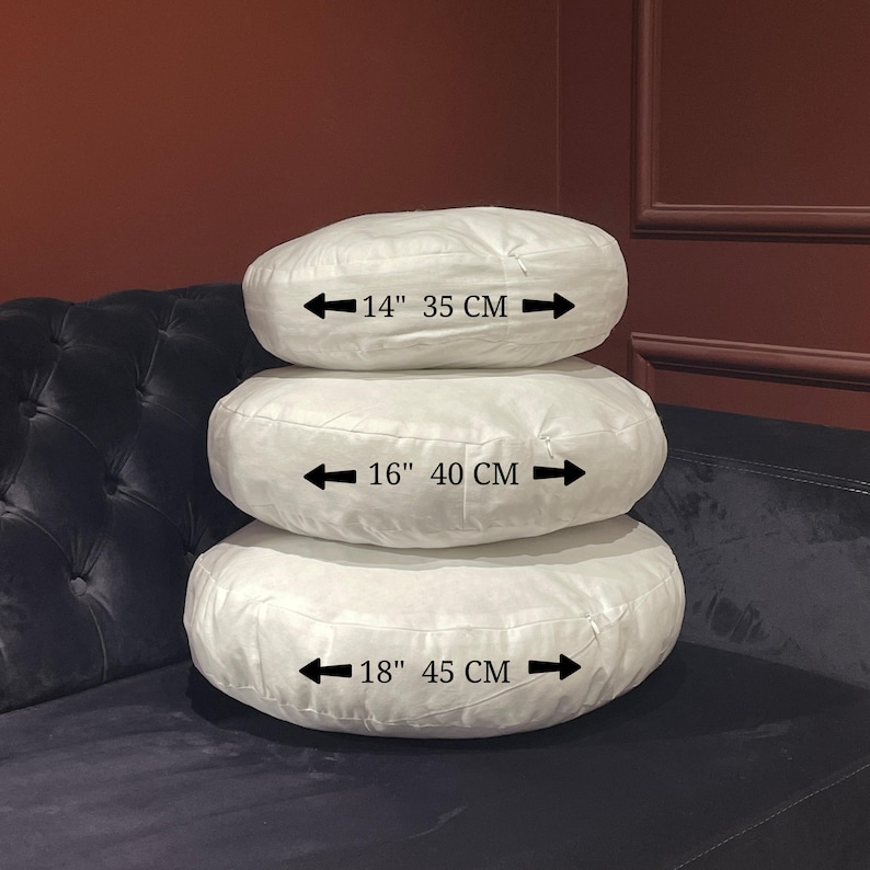 May include: Three white round cushions of different sizes stacked on top of each other. The cushions are 14 inches (35 cm), 16 inches (40 cm), and 18 inches (45 cm) in diameter.