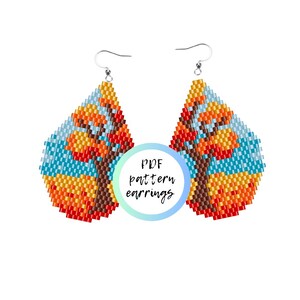 May include: A pair of beaded earrings with a fall-themed design. The earrings are teardrop shaped and feature a tree with orange, yellow, and brown leaves against a blue sky background. The text "PDF pattern earrings" is visible in the center of the image.