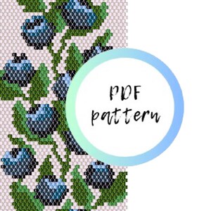 May include: A beadwork pattern featuring a repeating design of dark blue blueberries and green leaves on a light pink background. A circular graphic with a light blue gradient border overlays the pattern, containing the text PDF pattern.