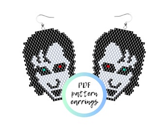 May include: A pair of black and white bead earrings with a face design. The earrings are made with black and white beads and have red and green eyes. The earrings are labeled "PDF pattern earrings".