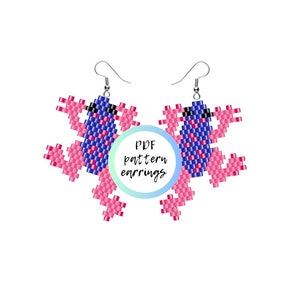 May include: A pair of pink and blue beaded frog earrings. The earrings are made with seed beads and are shaped like frogs. The earrings are attached to silver ear wires. The image includes the text "PDF pattern earrings".