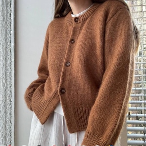 Janette Cardigan Knitting Pattern: oversized cardigan with crewneck,buttonholes and drop shoulders.