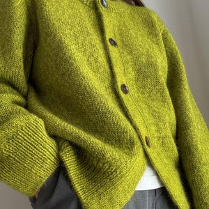 Top down cardigan pattern displayed on the designer in relaxed Scandinavian style poses.