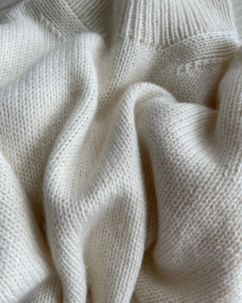 Create a warm Ness Sweater with a standing long neck using MorecaKnit's knitting pattern