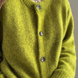 Intermediate knitting tutorial with folded edge and double knitting details on the button bands.