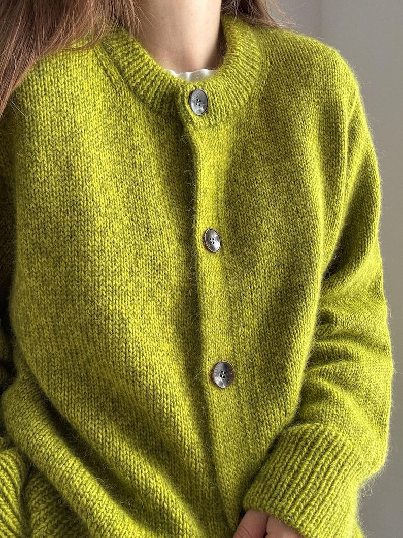 Intermediate knitting tutorial with folded edge and double knitting details on the button bands.