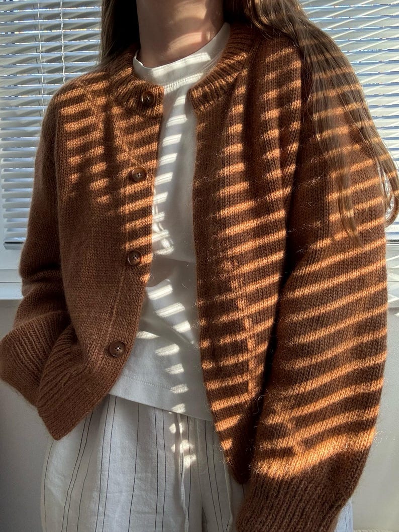 Modern cardigan tutorial featuring top down yoke shaping and relaxed silhouette.
