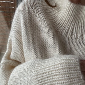 Ness Sweater knitting pattern by MorecaKnit, a warm sweater with long stand-up collar