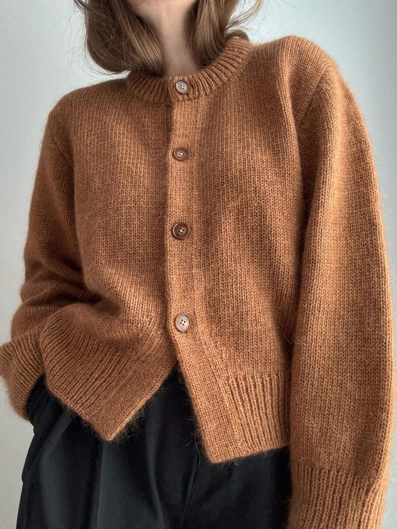 Janette Cardigan with folded edge finish and neat double knitting front bands.