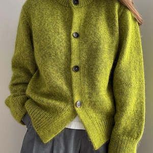 Janette Cardigan knitting pattern showing an oversized, slightly cropped button up cardigan by Moreca Knit.