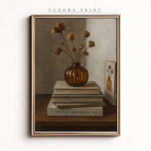 May include: A framed still life print featuring a brown vase with dried flowers atop a stack of books. The print includes the text "YUNORA PRINT" at the top and "VINCENT VAN DUTSE 2004" on a book. The artwork has a warm, neutral color palette.