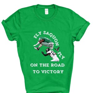 Saquon Barkley Hurdle Backwards Tee Shirt Crewneck T-Shirt Unisex Eagles Football Philly Kelly Green, Fly Saquon Fly on the Road to Victory,