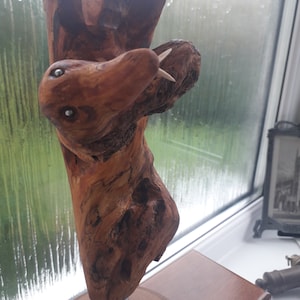 Unique Natural Hand Made 27 cm x 17 cm Wood Carving of a Mythical Tree Serpent and Wood Spirit Entwined in Battle for Control of the Forest