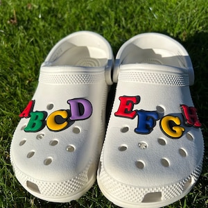 White crocs with rainbow letters cheap